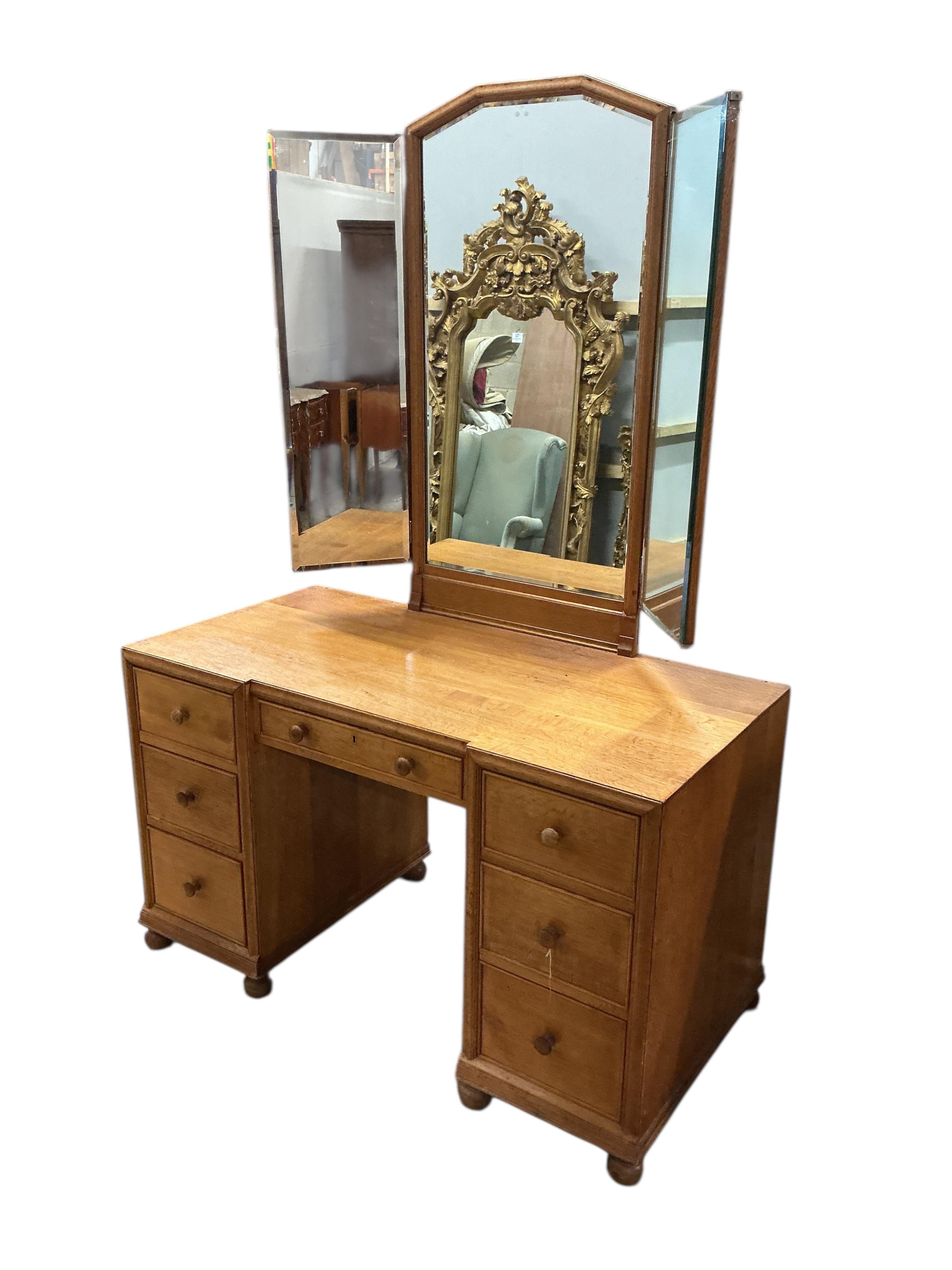 A Heals oak kneehole dressing table, width 114cm, depth 56cm, height 168cm